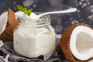 Coconut,Yogurt,In,A,Glass,Jar,On,A,Dark,Background,