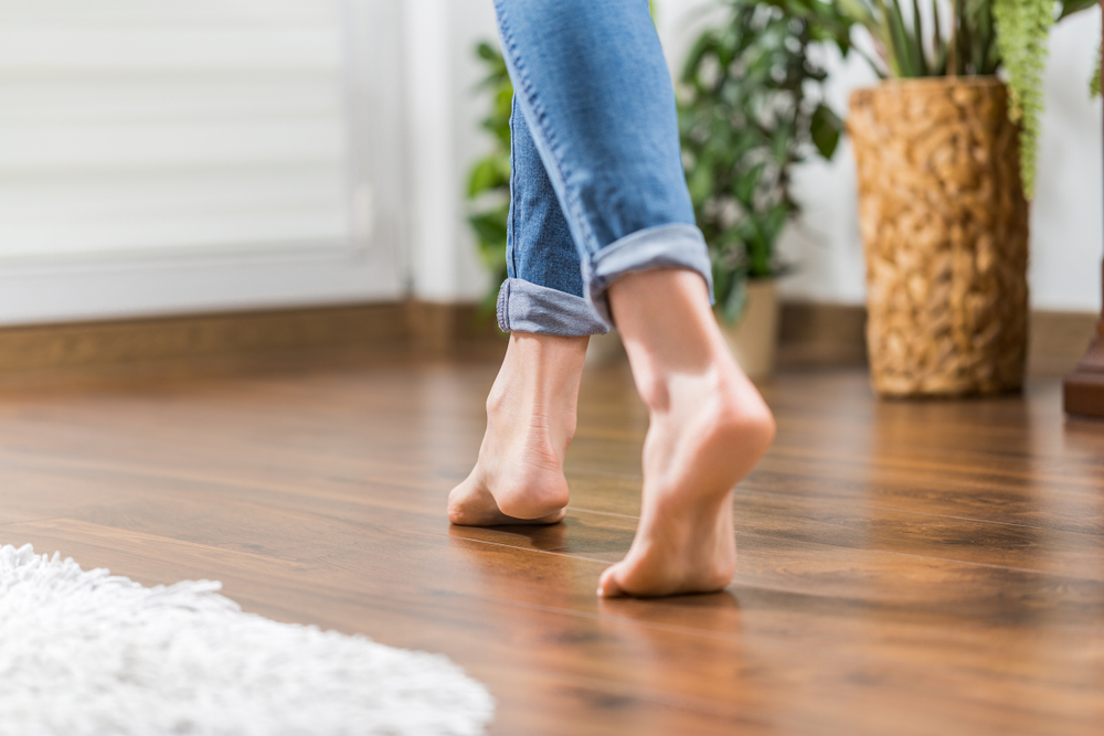 Floor,Heating.,Young,Woman,Walking,In,The,House,On,The