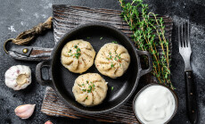 Asian,Steamed,Dumplings,Manti,In,A,Pan.,Black,Background.,Top