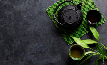 Green,Japanese,Tea,On,Stone,Table.,Top,View,With,Copy