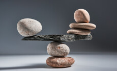 Balancing,Pyramid,Of,Sea,Pebbles,On,A,Gray,Background,,The