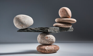 Balancing,Pyramid,Of,Sea,Pebbles,On,A,Gray,Background,,The