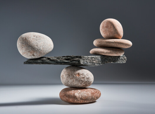 Balancing,Pyramid,Of,Sea,Pebbles,On,A,Gray,Background,,The