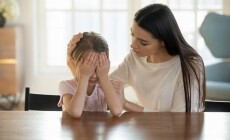 Caring,Mother,Calming,And,Hugging,Crying,Upset,Little,Daughter,,Sitting