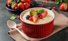 Delicious,Semolina,Pudding,With,Berries,And,Mint,Served,On,Grey