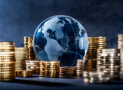 Globe,And,Stack,With,Coins.,Money,Makes,The,World,Go
