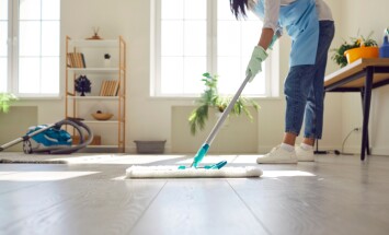 Housewife,Or,Professional,Cleaner,Mopping,The,Floor,At,Home.,Crop