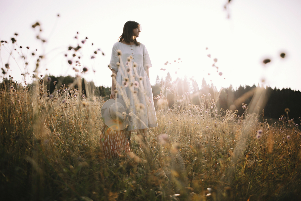 Stylish,Girl,In,Rustic,Dress,Standing,Among,Wildflowers,And,Herbs