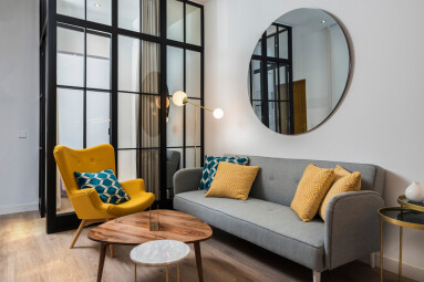 Colorful,And,Cozy,Living,Room,With,A,Designer,Armchair,And