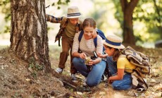 Happy,Family:,Two,Kids,Boy,And,Girl,With,Backpacks,Looking