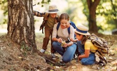 Happy,Family:,Two,Kids,Boy,And,Girl,With,Backpacks,Looking