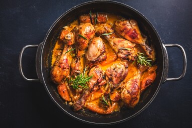 Baked,Chicken,Drumsticks,With,Vegetables,,Casserole,Dish,On,Black,Background