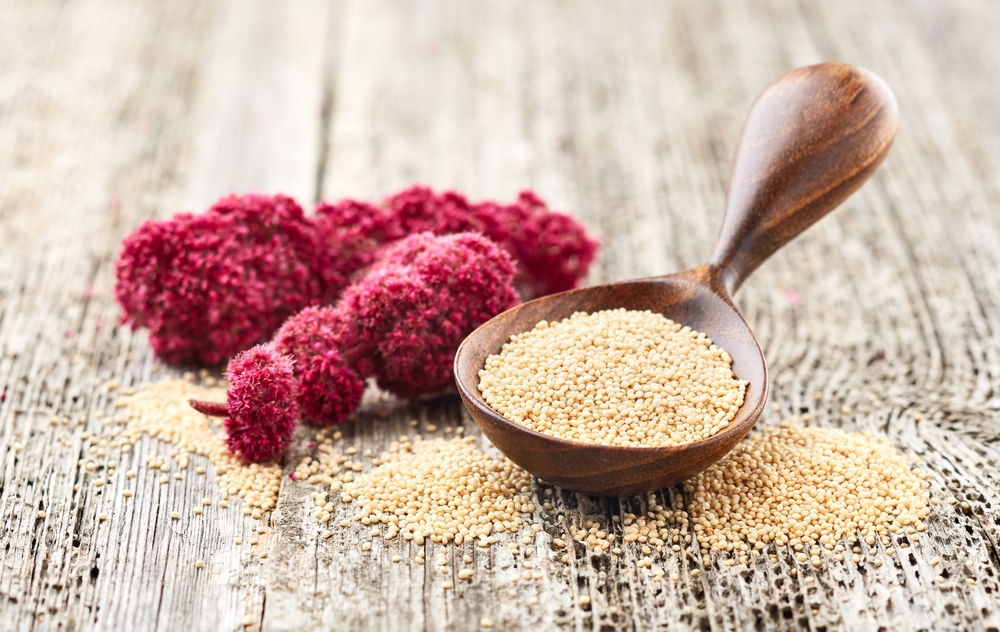Amaranth,Plant,And,Seeds,On,Wooden,Background