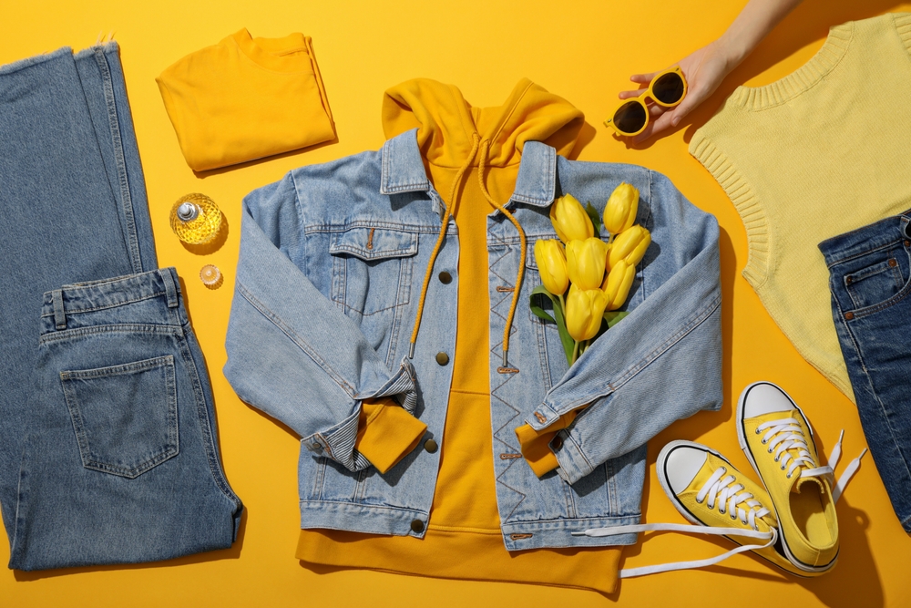 Female,Spring,Wardrobe,,Flowers,And,Glasses,In,Hand,On,Yellow
