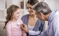 Pediatrician,Checks,Breath,Stethoscope,A,Little,Girl,In,The,Arms