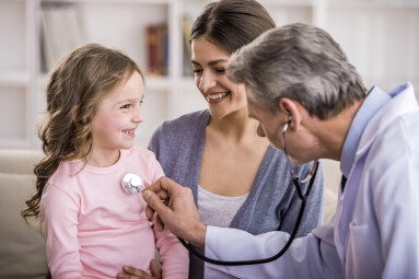 Pediatrician,Checks,Breath,Stethoscope,A,Little,Girl,In,The,Arms
