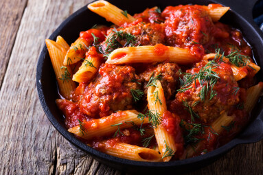 Meatball,Penne,Pasta,With,Spicy,Tomato,Sauce,And,Dill,In