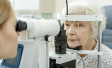 Young,Female,Ophthalmologist,Using,Apparatus