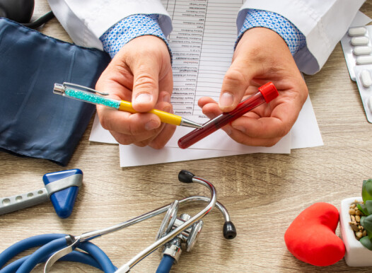Doctor,During,Consultation,Held,In,His,Hand,And,Shows,Patient