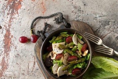 A,Bowl,Of,Salad,With,Asparagus,,Grapes,And,Champignons,On