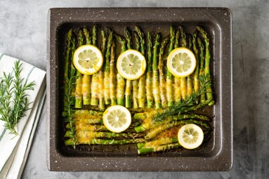 Asparagus,Baked,With,Sliced,Lemon,,Fresh,Rosemary,,Butter,,And,Cheese.
