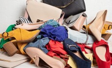Fast,Fashion,Background,With,Pile,Of,Cheap,,Low,Quality,Clothes.