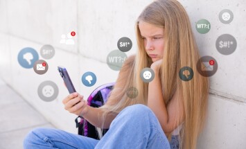 Sad,Girl,Viewing,Negative,Reactions,And,Comments,On,Social,Media,