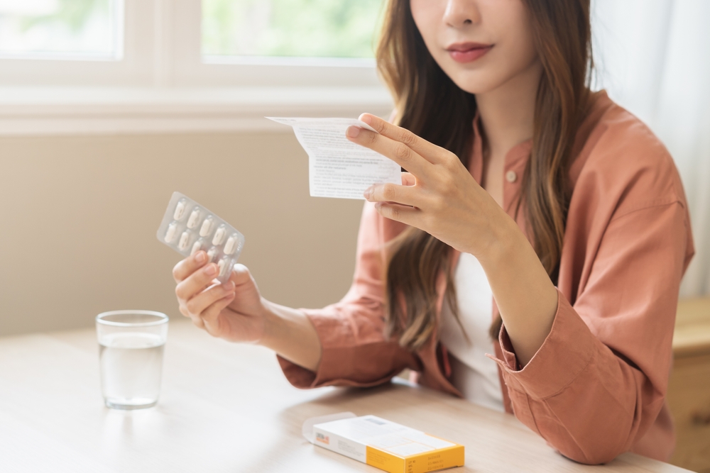 Health,Care,Treatment,Asian,Young,Woman,Holding,Prescription,Of,Capsule