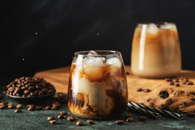 Ice,Coffee,In,A,Tall,Glass,With,Cream,Poured,Over,