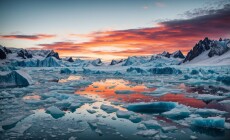 A,Stark,Image,Of,A,Melting,Ice,Cap,With,Its