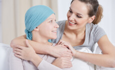 Young,Woman,With,Blue,Headscarf,Looking,And,Smiling,At,Her