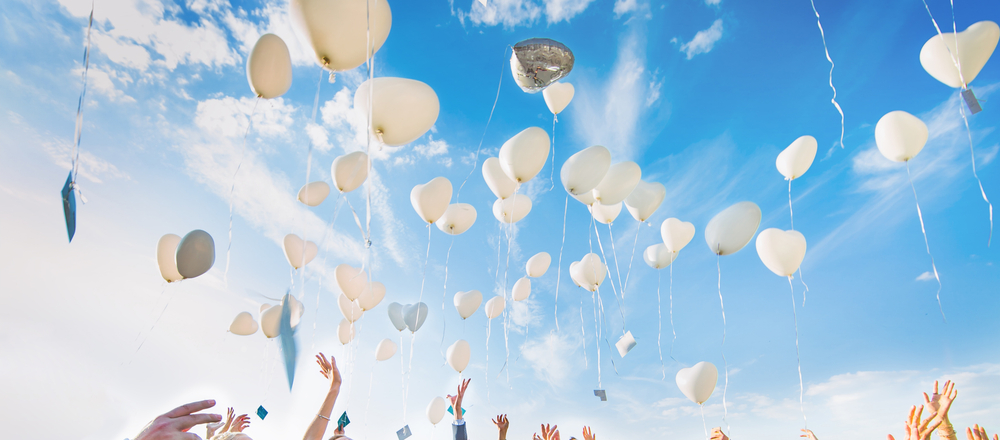 Several,Baloons,Flying,In,Blue,Sky