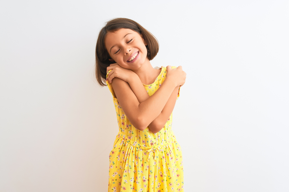 Young,Beautiful,Child,Girl,Wearing,Yellow,Floral,Dress,Standing,Over