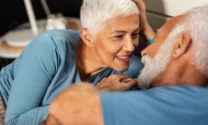 Happy,Senior,Couple,Lying,Together,In,Bed