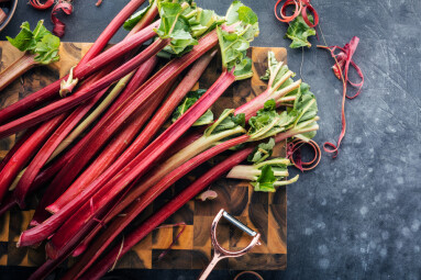 Chopped,Fresh,Rhubarb,On,Dark,Stone,Background.,Top,View.,Free