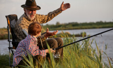 Grandfather,And,Kid,Boy,Together,Fishing,In,The,Evening,At