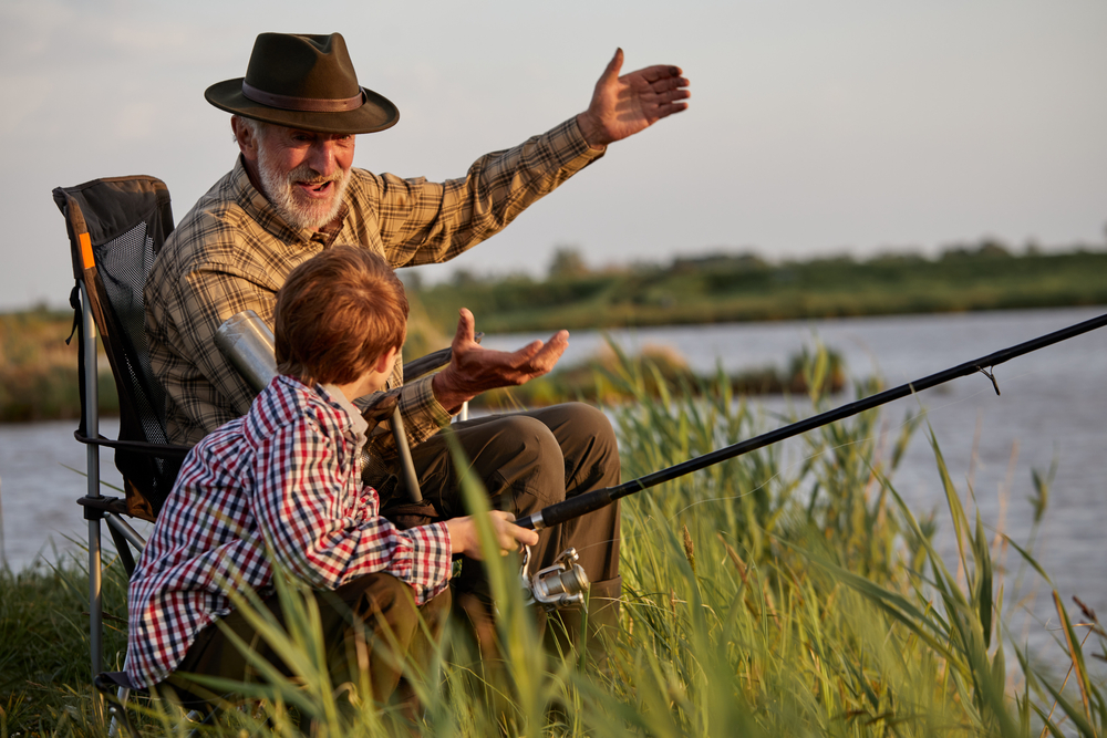 Grandfather,And,Kid,Boy,Together,Fishing,In,The,Evening,At
