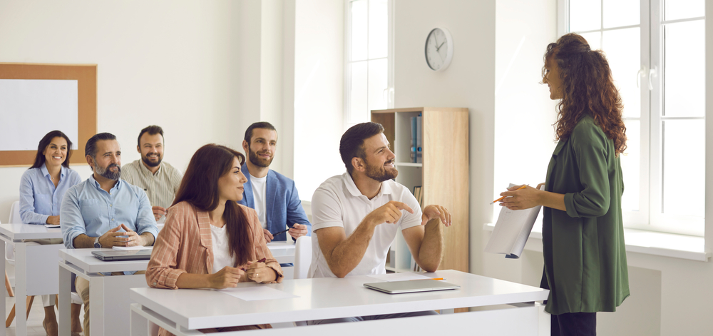 College,Teacher,Or,Business,Course,Trainer,Having,Discussion,With,Group