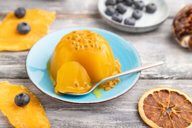 Mango,And,Passion,Fruit,Jelly,With,Blueberry,On,Gray,Wooden