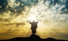 Silhouette,Of,Jesus,Praying,With,Raised,Hands,On,A,Mount