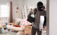 Male,Thief,Stealing,Safe,And,Monitor,In,Room