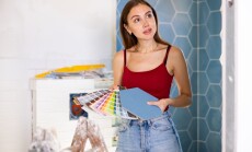 Young,Woman,With,Palette,Of,Colors,In,Hands,Selects,Harmonious
