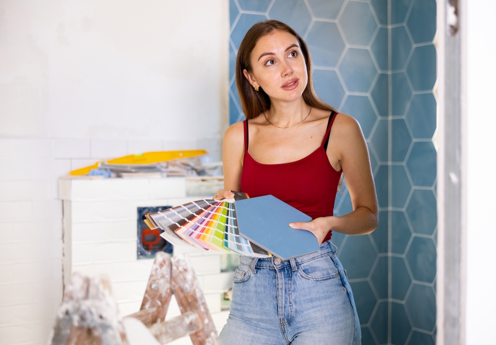 Young,Woman,With,Palette,Of,Colors,In,Hands,Selects,Harmonious