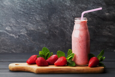 Strawberry,Smoothie,Or,Milkshake,In,Jar,On,Black,Rustic,Background,