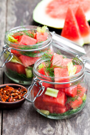 Marinated,Watermelon,With,Herbs,In,A,Glass,Jar,On,Wooden