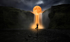 Woman,Doing,Yoga,In,Front,Of,A,Magic,Waterfall