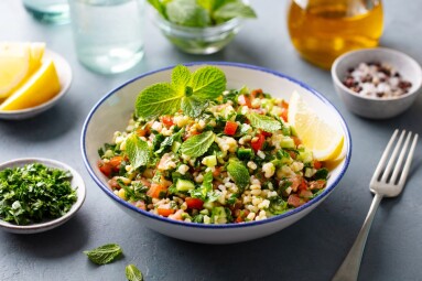 Tabbouleh,Salad,In,A,Bowl.,Grey,Background.,Close,Up.