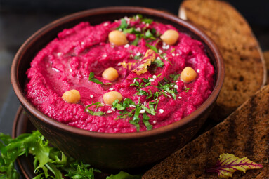 Roasted,Beet,Hummus,With,Toast,In,A,Ceramic,Bowl,On