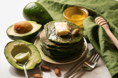 Tasty,Green,Pancakes,With,Avocado,On,Light,Table