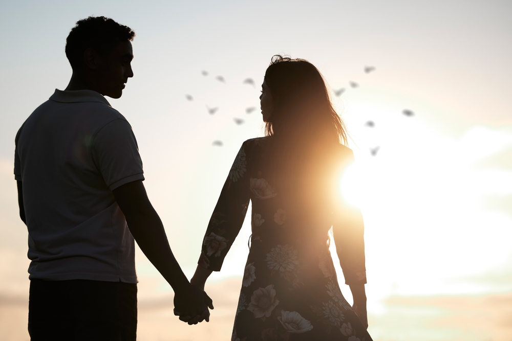 Couple,,Silhouette,And,Holding,Hands,At,Romantic,,Destination,,Holiday,Or